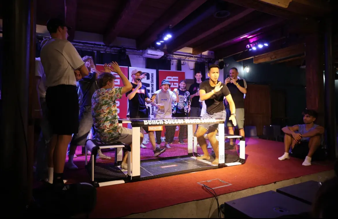 Players sit across from each other